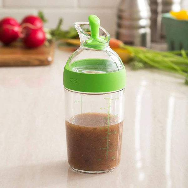 http://www.modernquests.com/cdn/shop/files/oxo-good-grips-salad-dressing-shaker-small-green-3_grande.jpg?v=1690059642