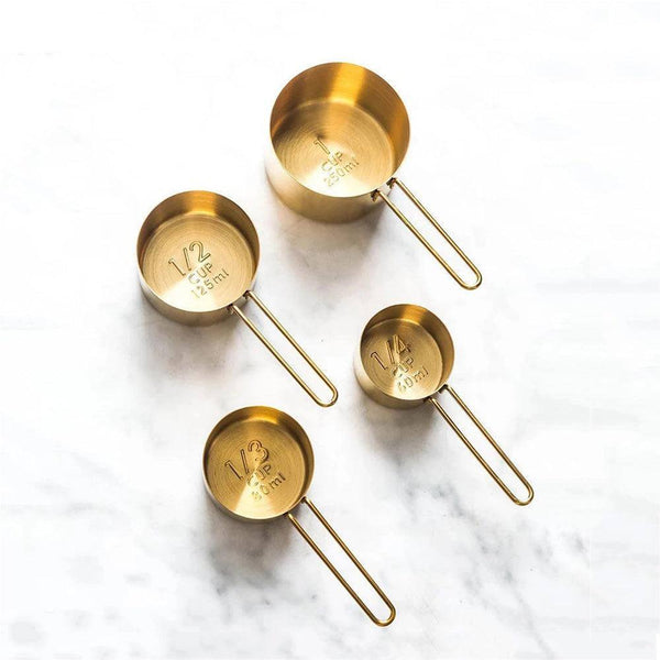 http://www.modernquests.com/cdn/shop/files/trudeau-4-piece-measuring-cup-set-gold-1_grande.jpg?v=1690051854