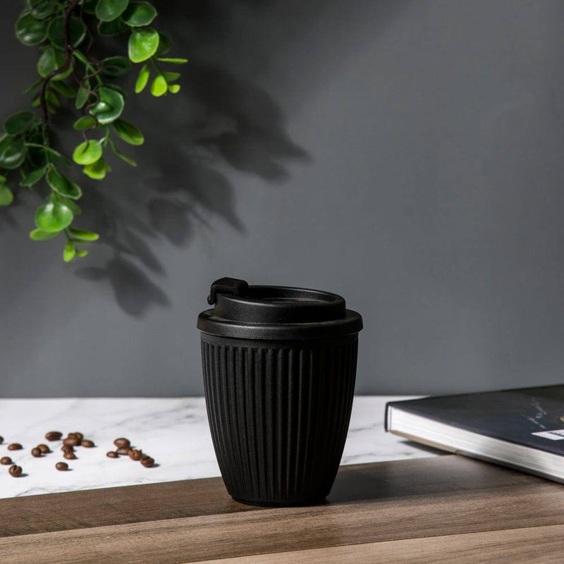 https://www.modernquests.com/cdn/shop/files/philosophy-home-reusable-coffee-mug-dotted-black-4_800x.jpg?v=1690058189